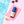 Soleil Glue eyelash extension adhesive with blue cap in mini pool studio setting with cocktail, towel and heart sunglasses