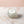 Wimperextensions Cream Remover van Luxury Lashes op een roze marmeren achtergrond.